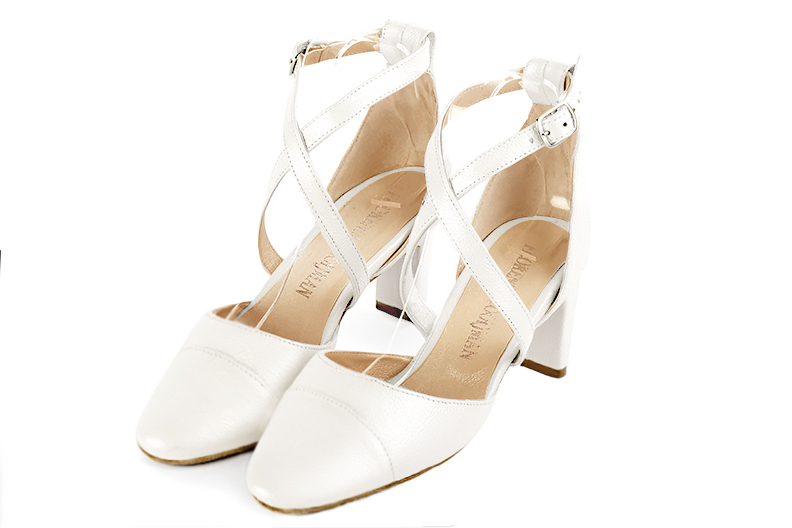 Pure white women's open side shoes, with crossed straps. Round toe. Medium comma heels. Front view - Florence KOOIJMAN